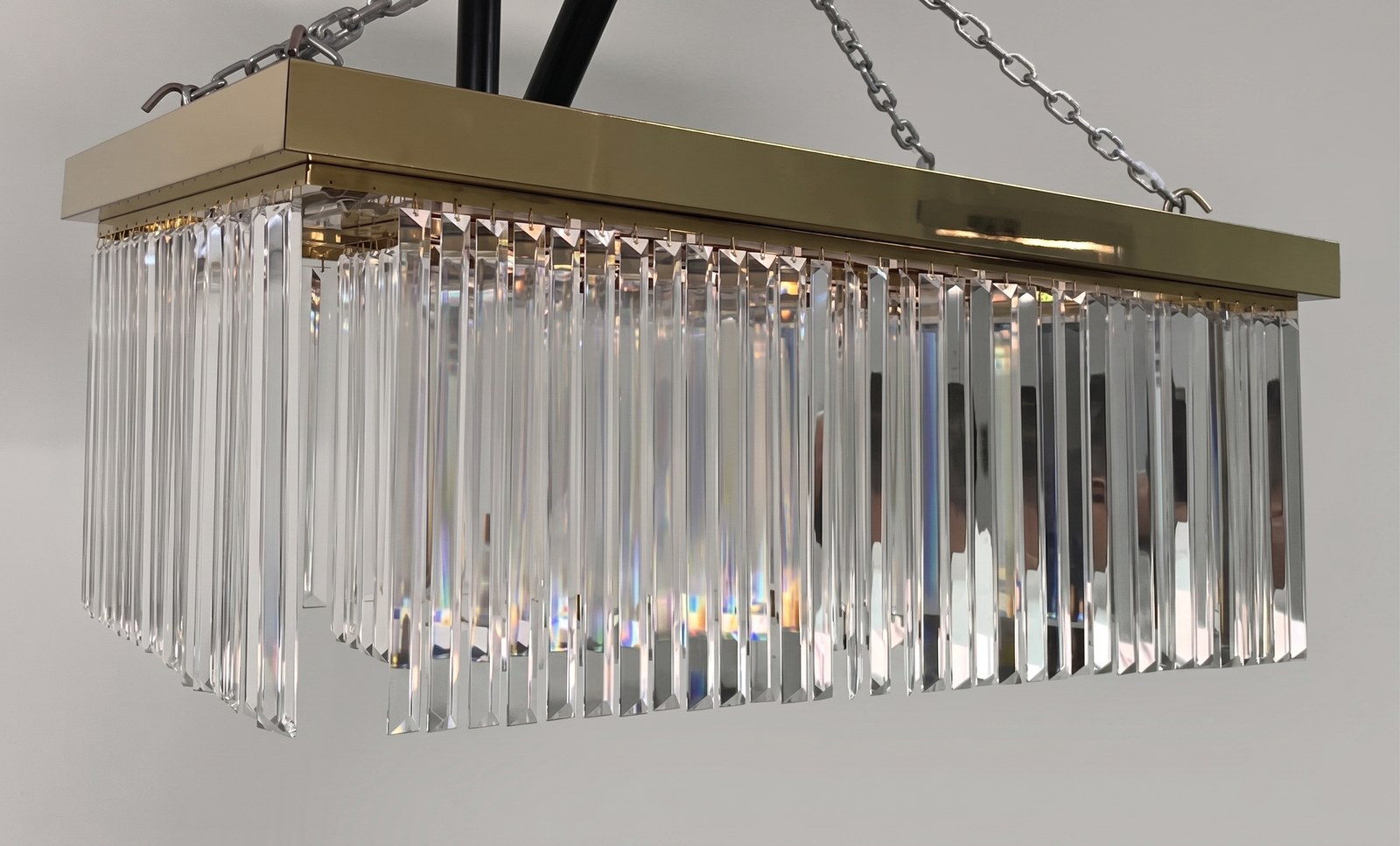 A section of the crystal chandelier built as a physical sample, brass housing and cut crystal rods, lit